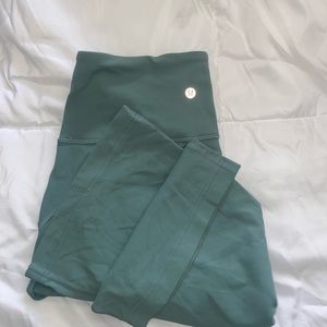 turquoise green Lululemon flare pants